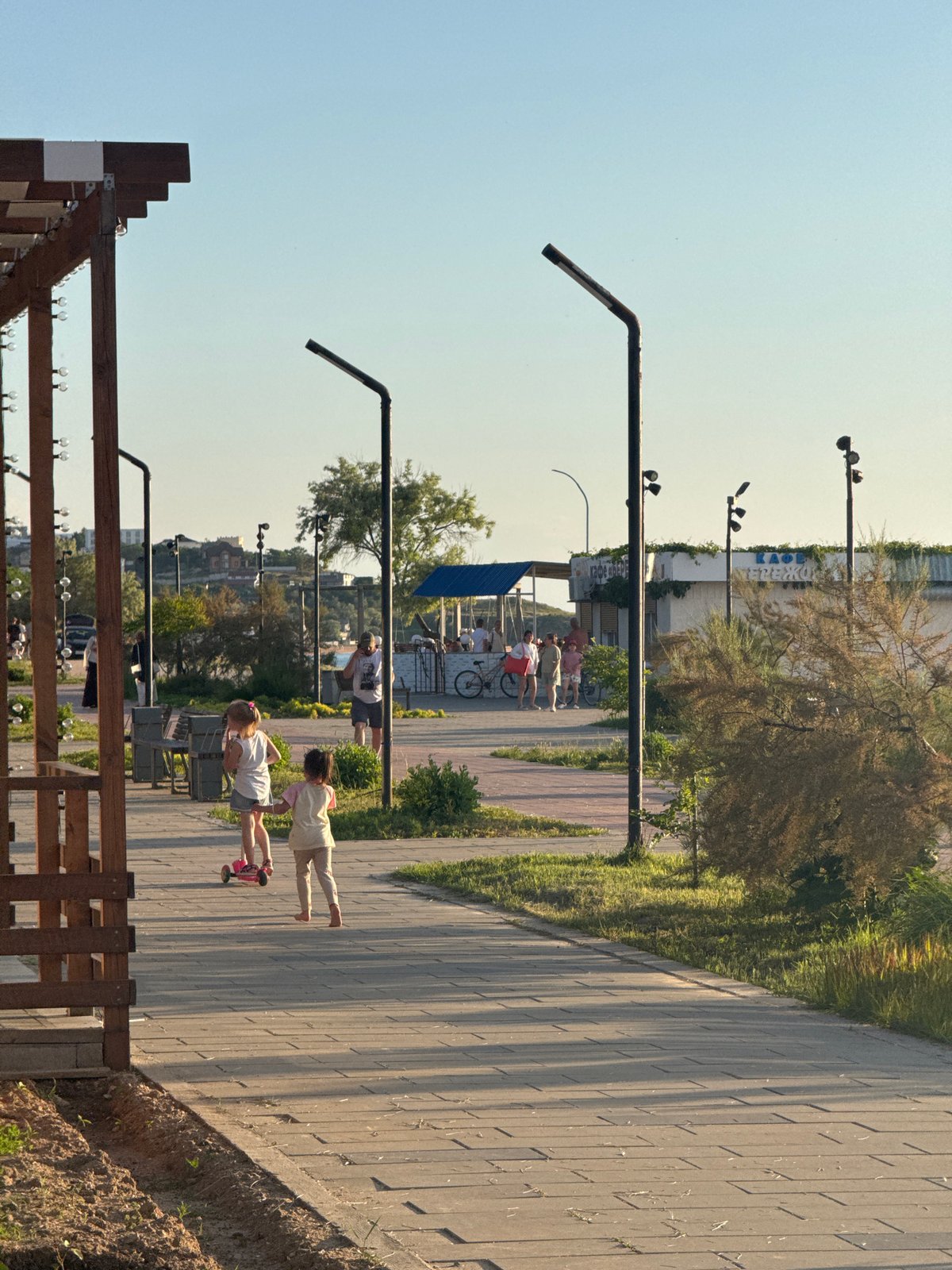 Afternoon stroll captured along Shcholkino waterfront promenade