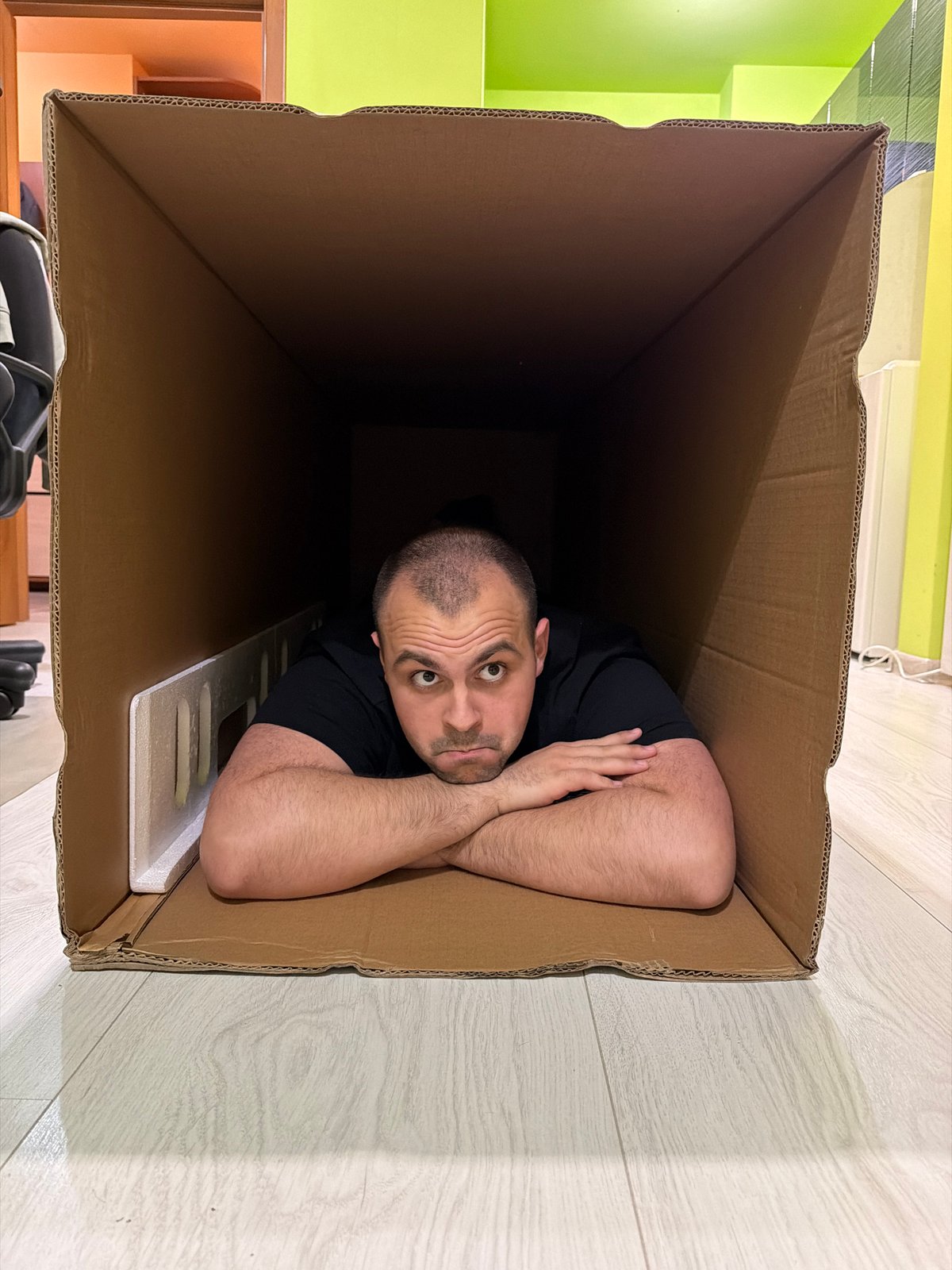 Man poses inside cardboard box in Plovdiv apartment