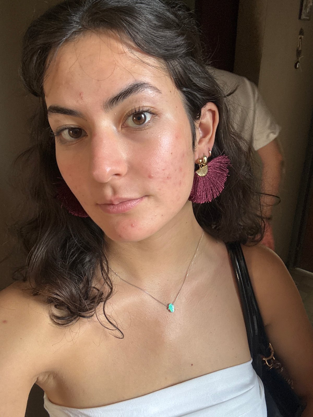 Woman photographed with keys, bag in Puebla hallway