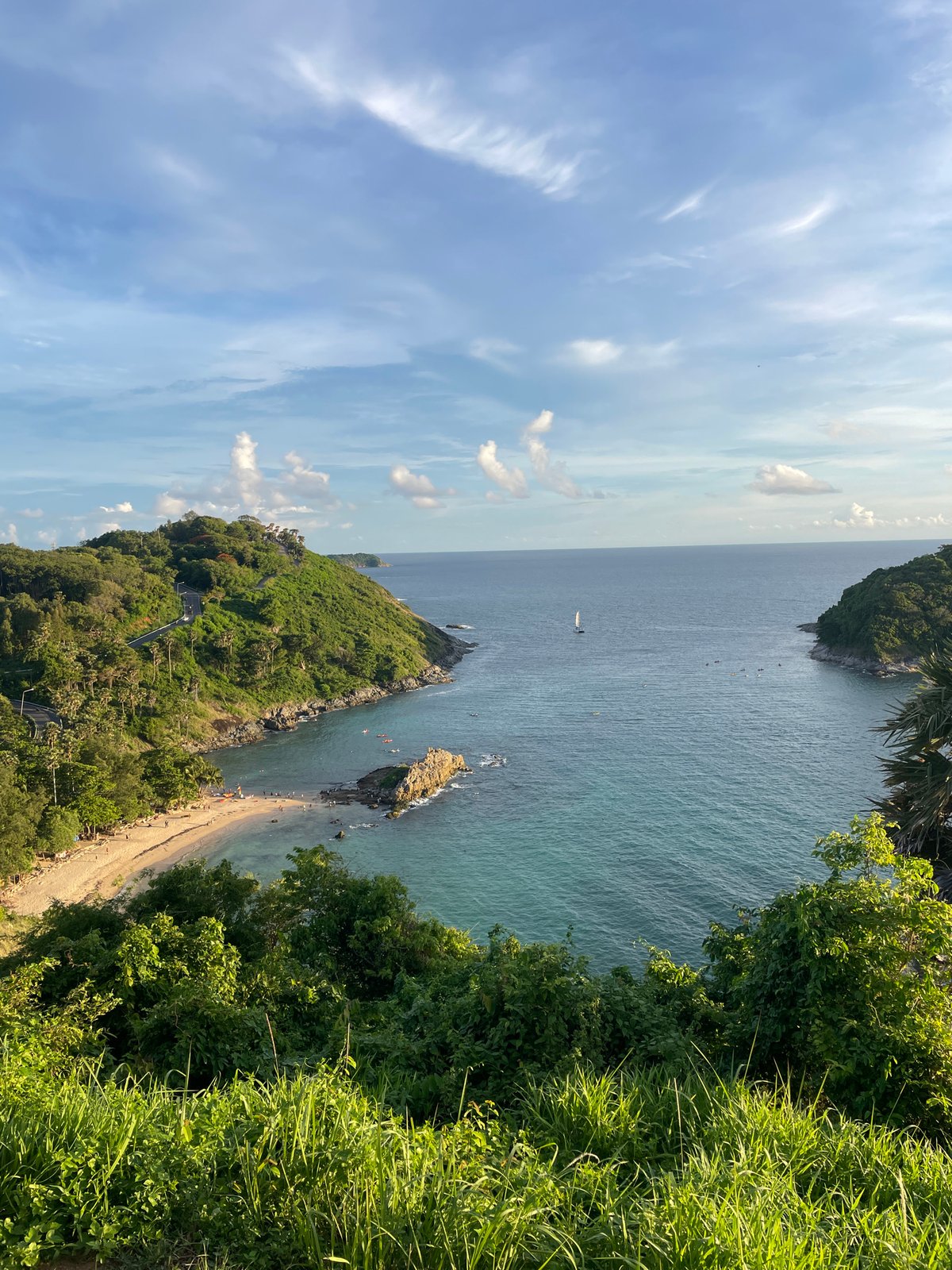 Paragliding and coastal life along Rawai's shoreline