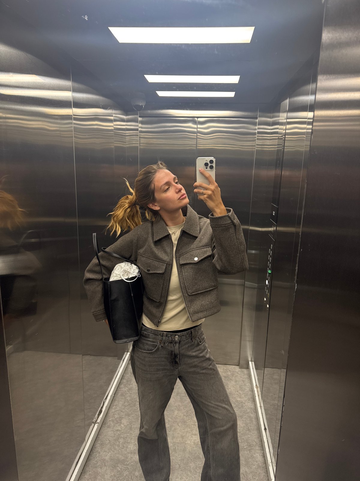 Person Takes Selfie in Stainless Steel Elevator