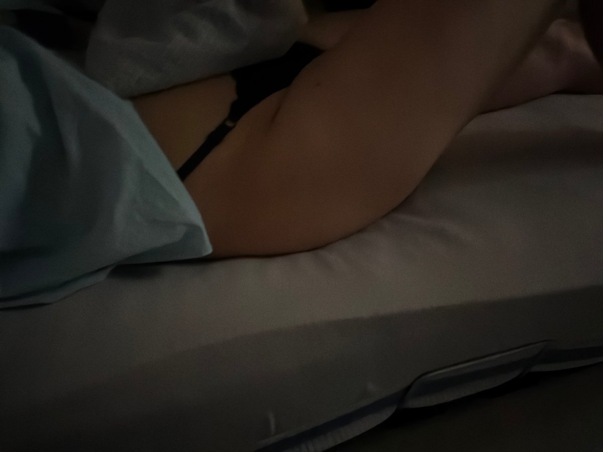 Person watches TV in bed during late night hours