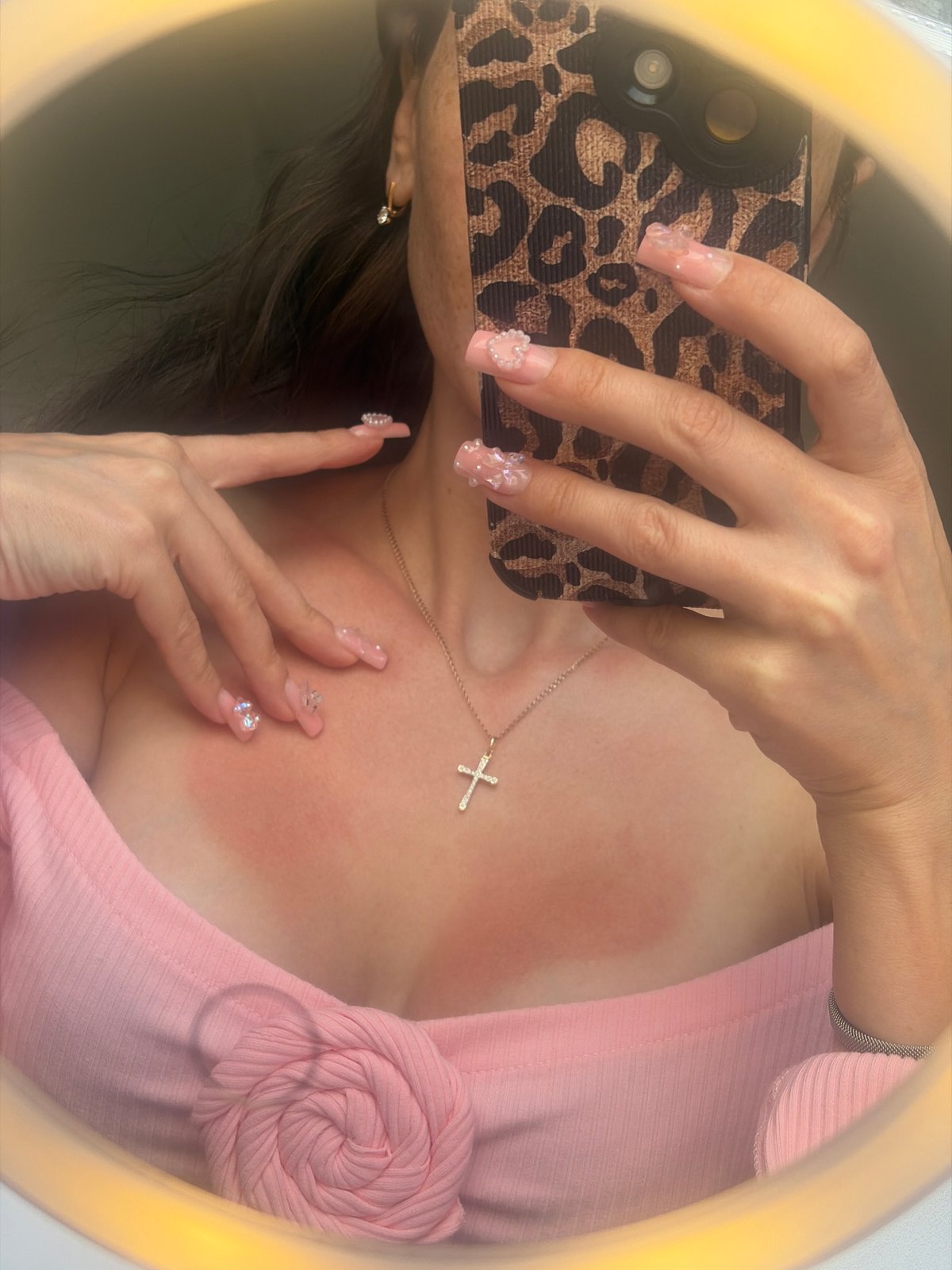 Person documents pink outfit details in Russia selfie session