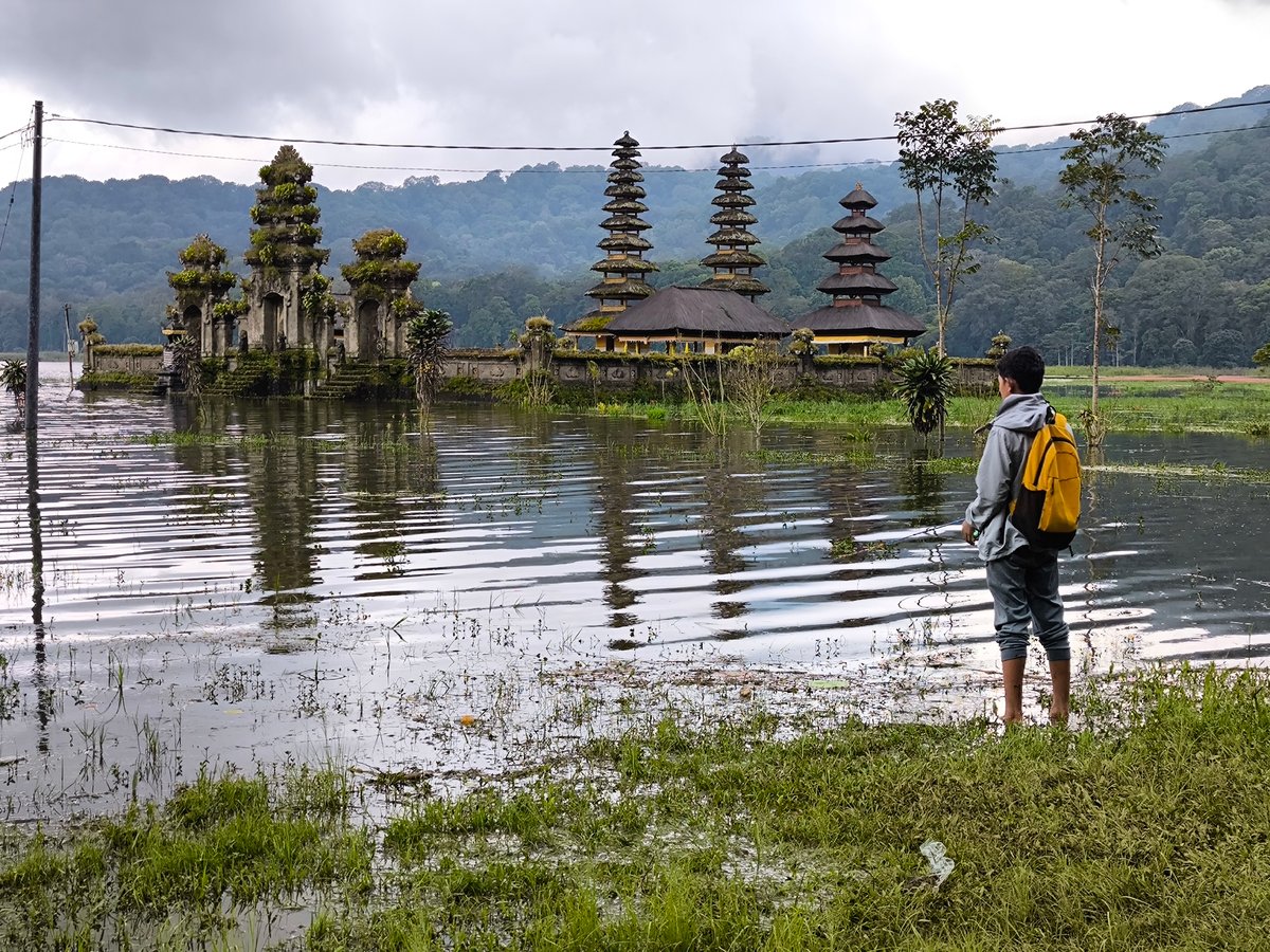 Fishing and temple scenes documented in Indonesian forest setting