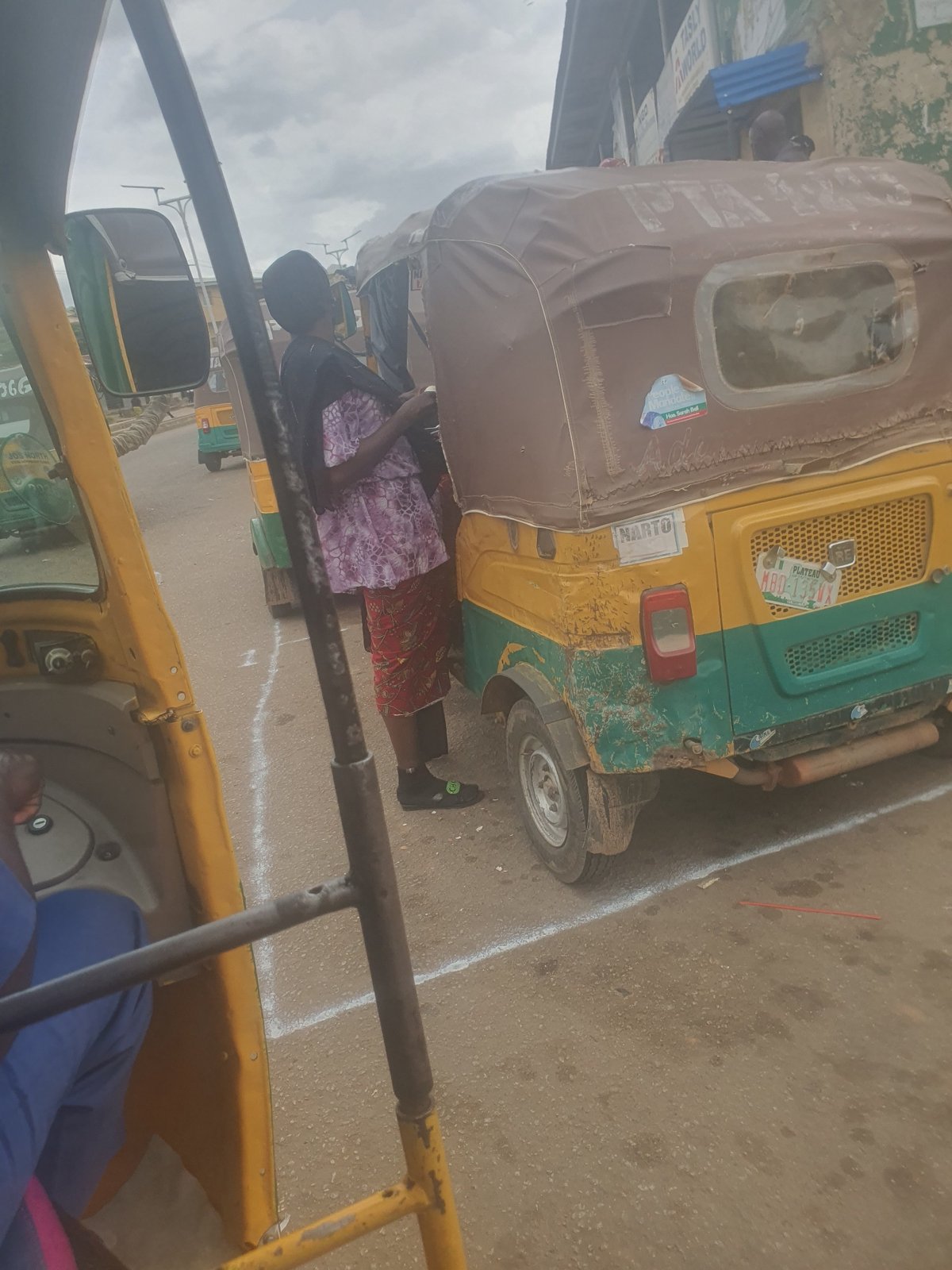 Street-level moments across Jos neighborhoods on a cloudy afternoon