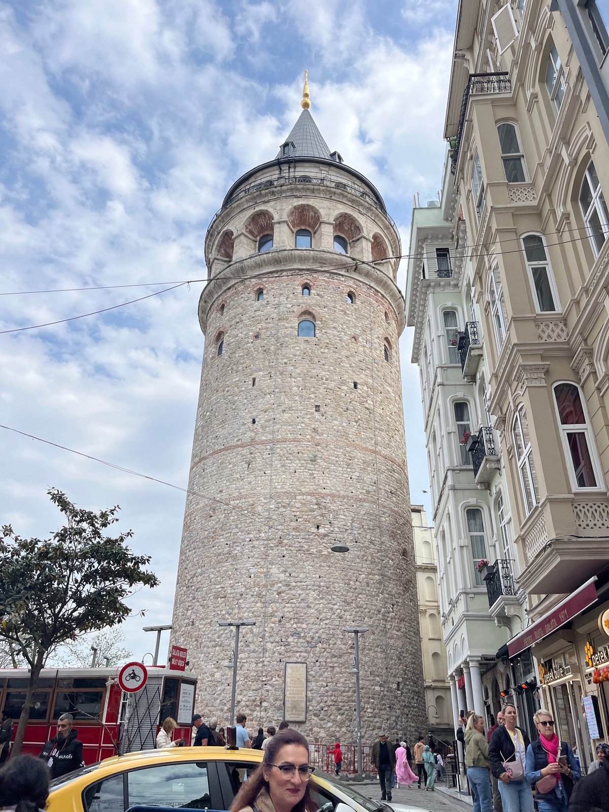 Tourists gather around historic Galata Tower in Istanbul's Beyoğlu district