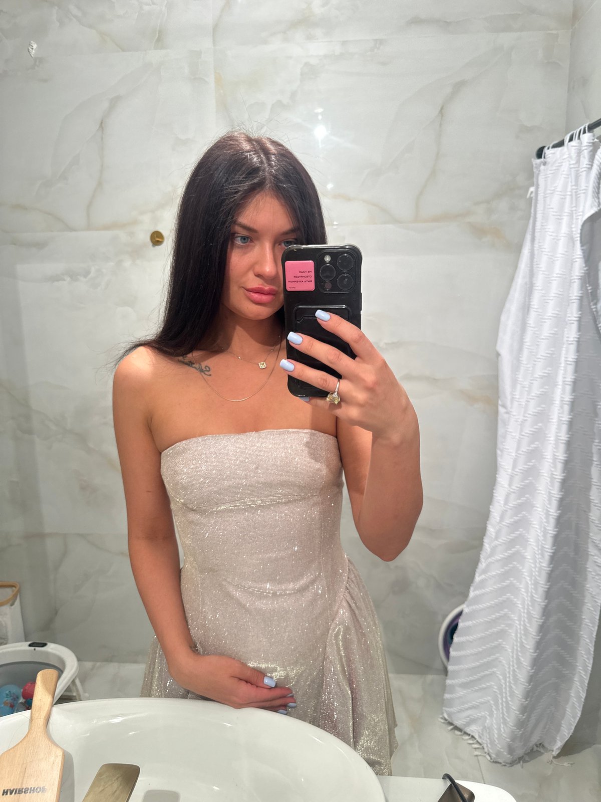 Woman takes rotated mirror selfie in Krasnogorsk bathroom