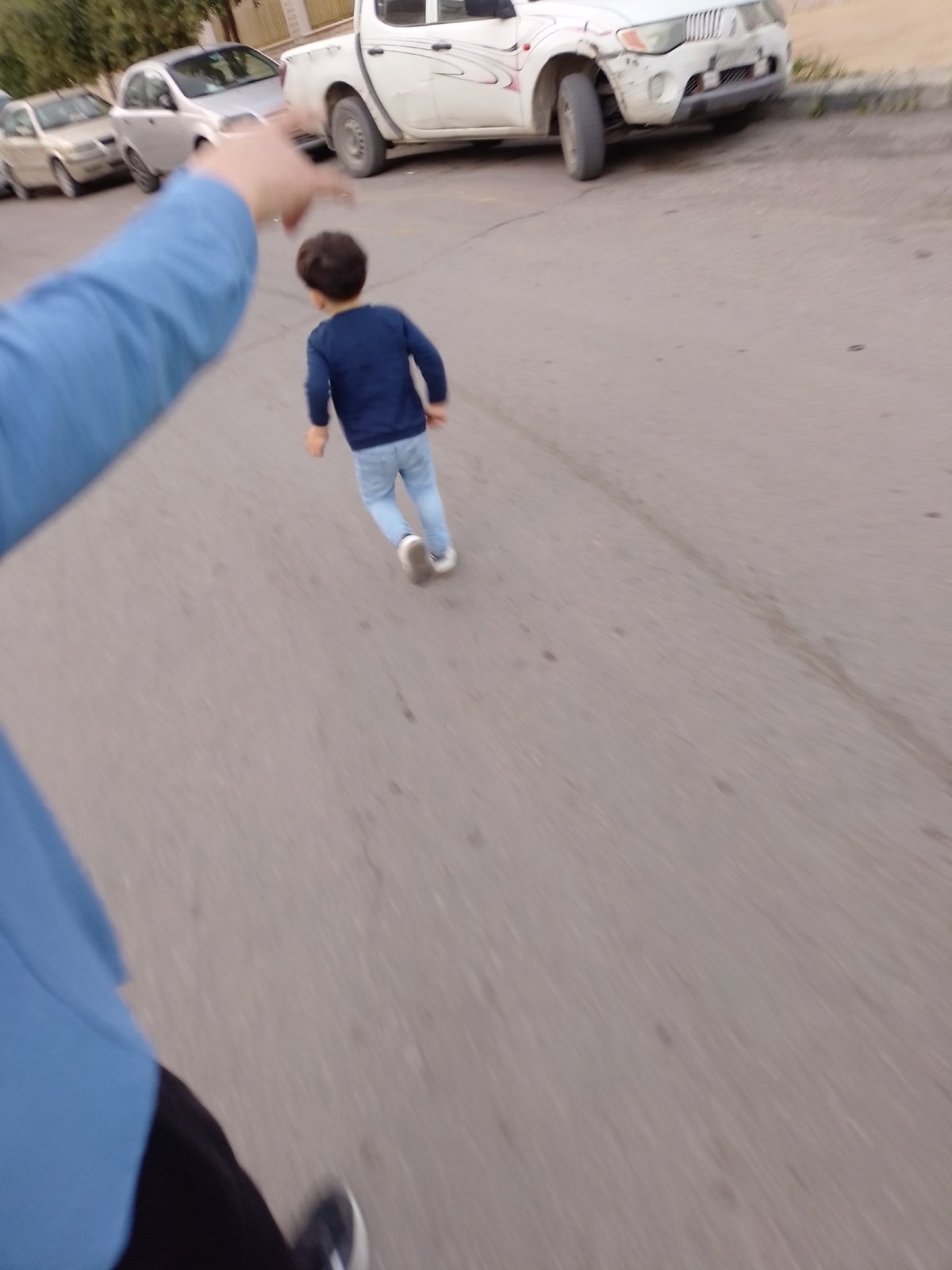 Child runs down street in Barza Municipality, Syria