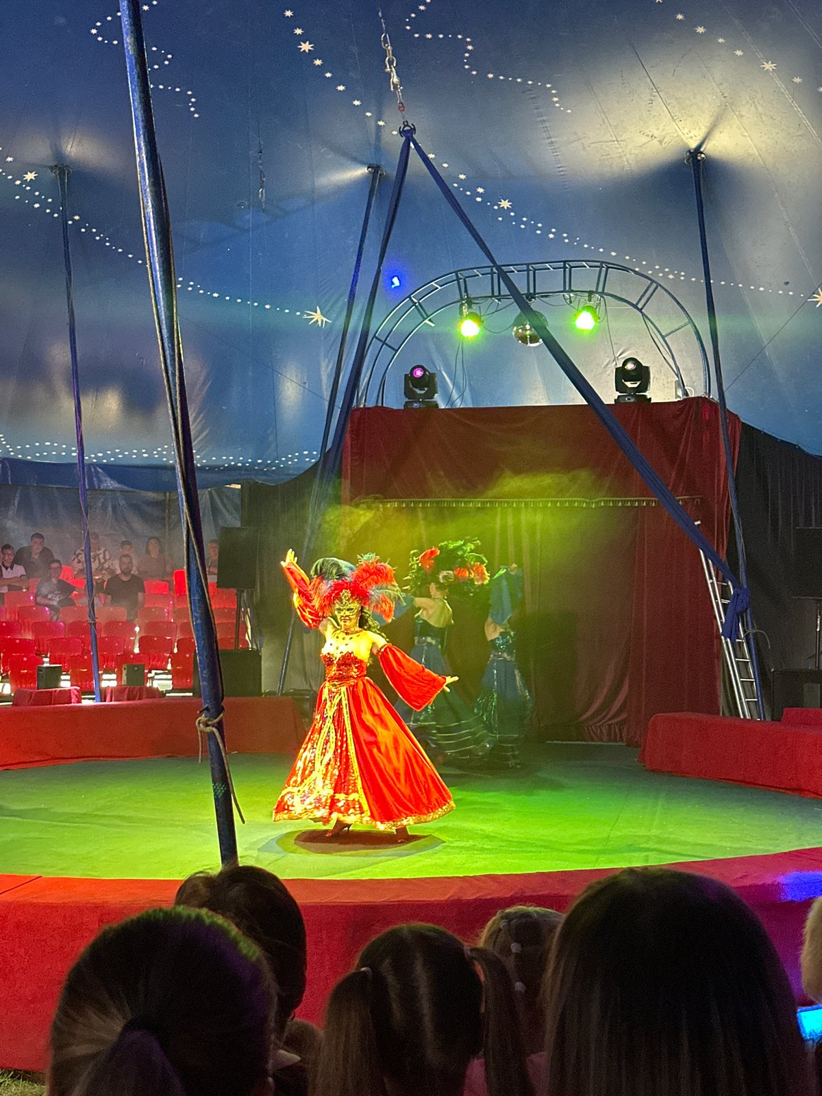 Circus show underway in Novoaltaysk tent with costumed performers