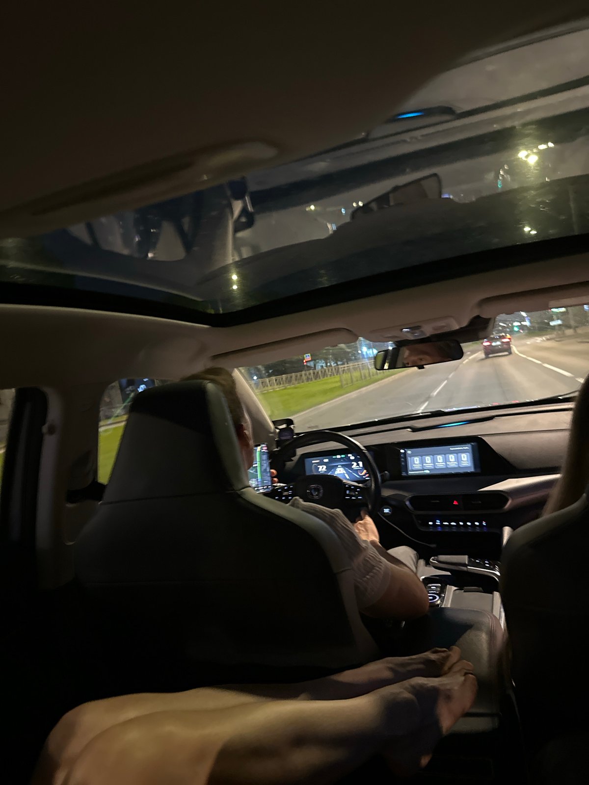 Driver uses navigation app while driving at night in Saint Petersburg