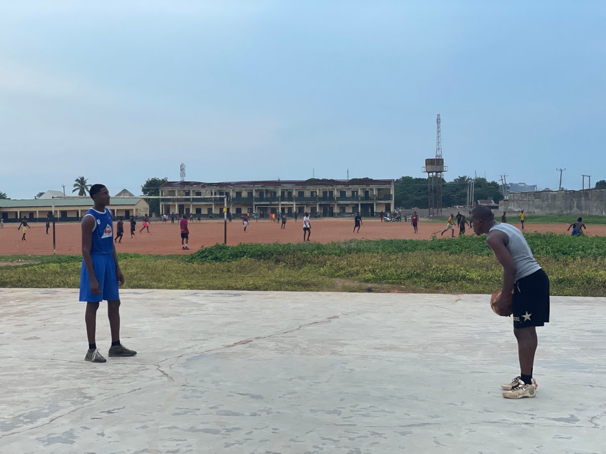 Evening basketball games captured on outdoor courts in Akwanga