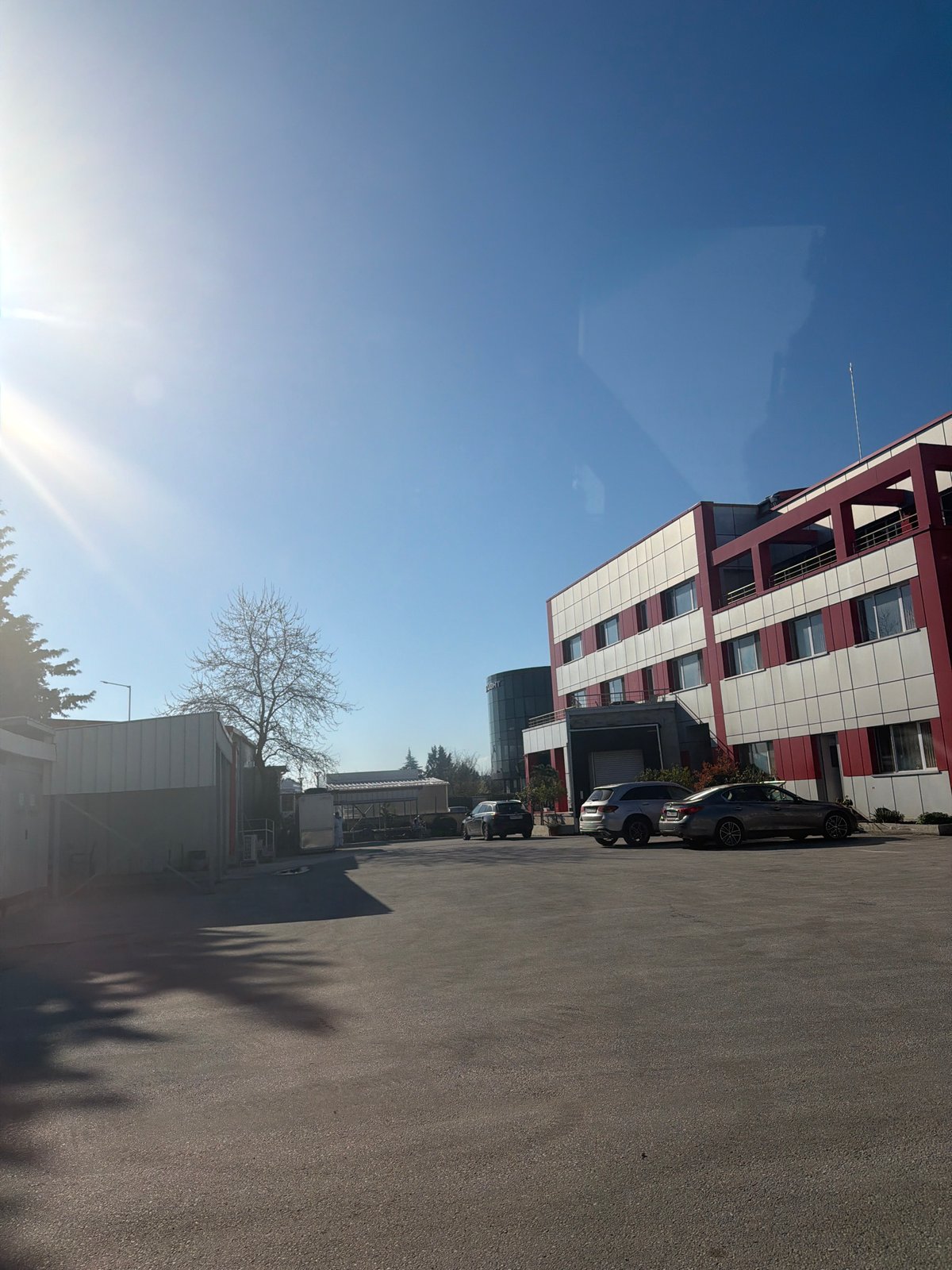 Modern red-white building with metal structure observed in Plovdiv