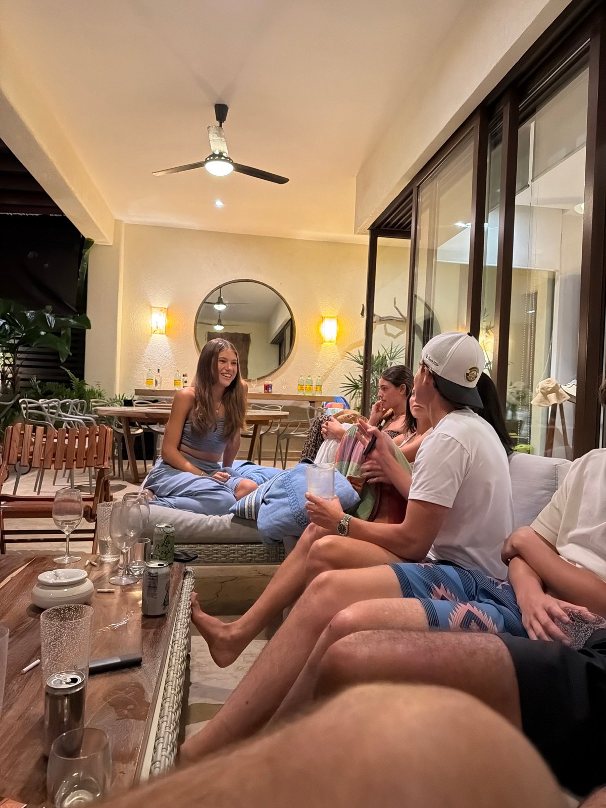 Outdoor social gathering documented in warm climate setting