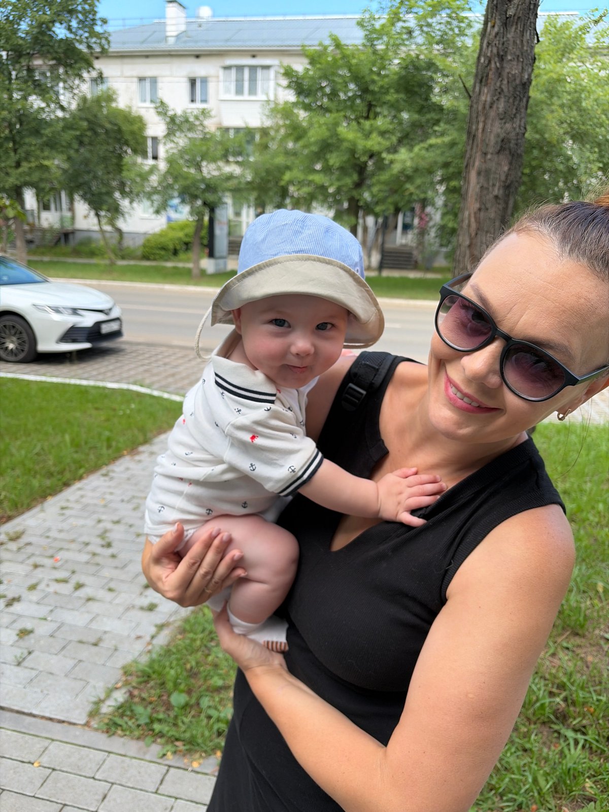 Summer morning stroll in Chaikovsky with a baby and flowers
