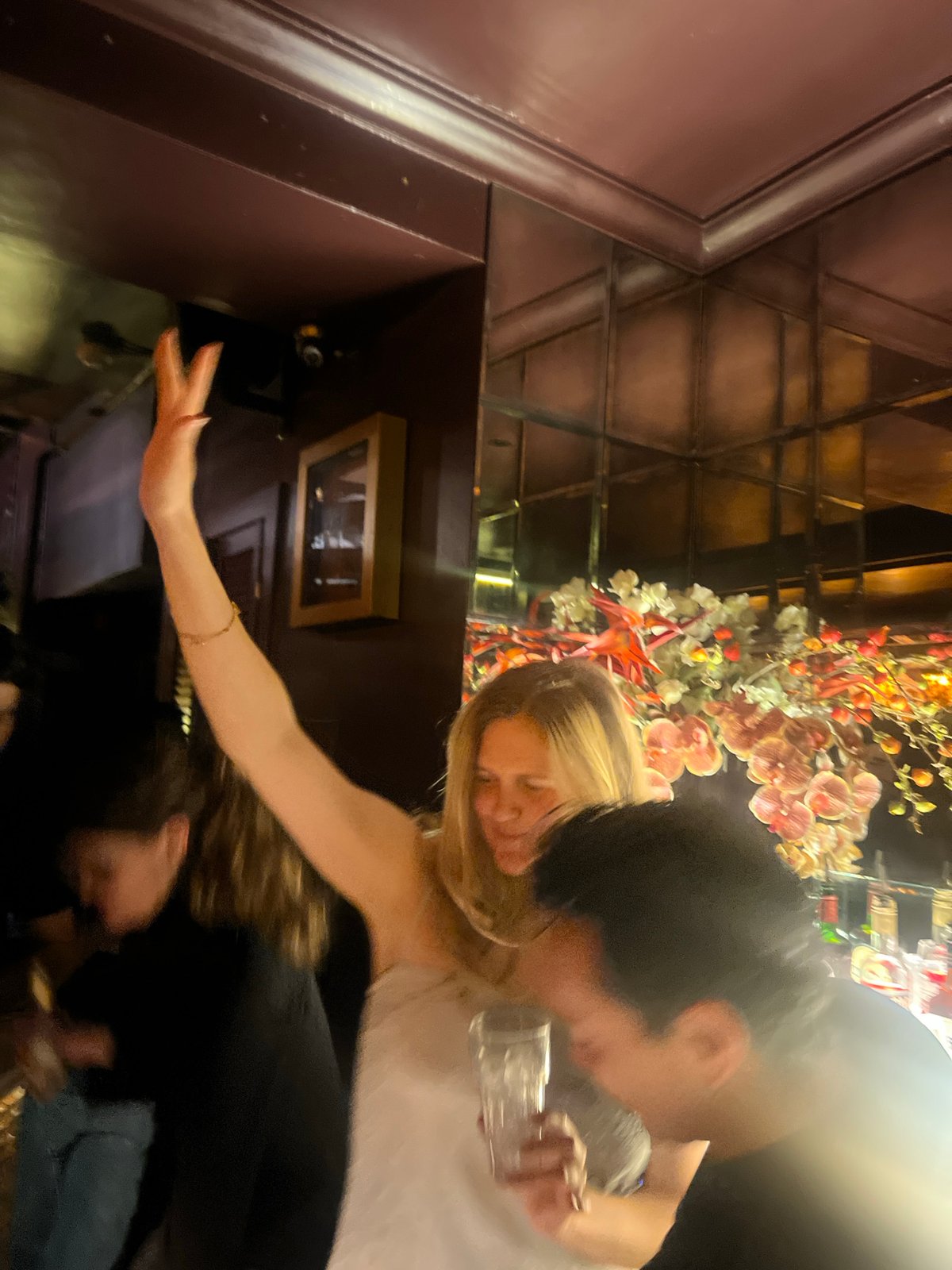Late-night celebration at London bar features champagne toasts