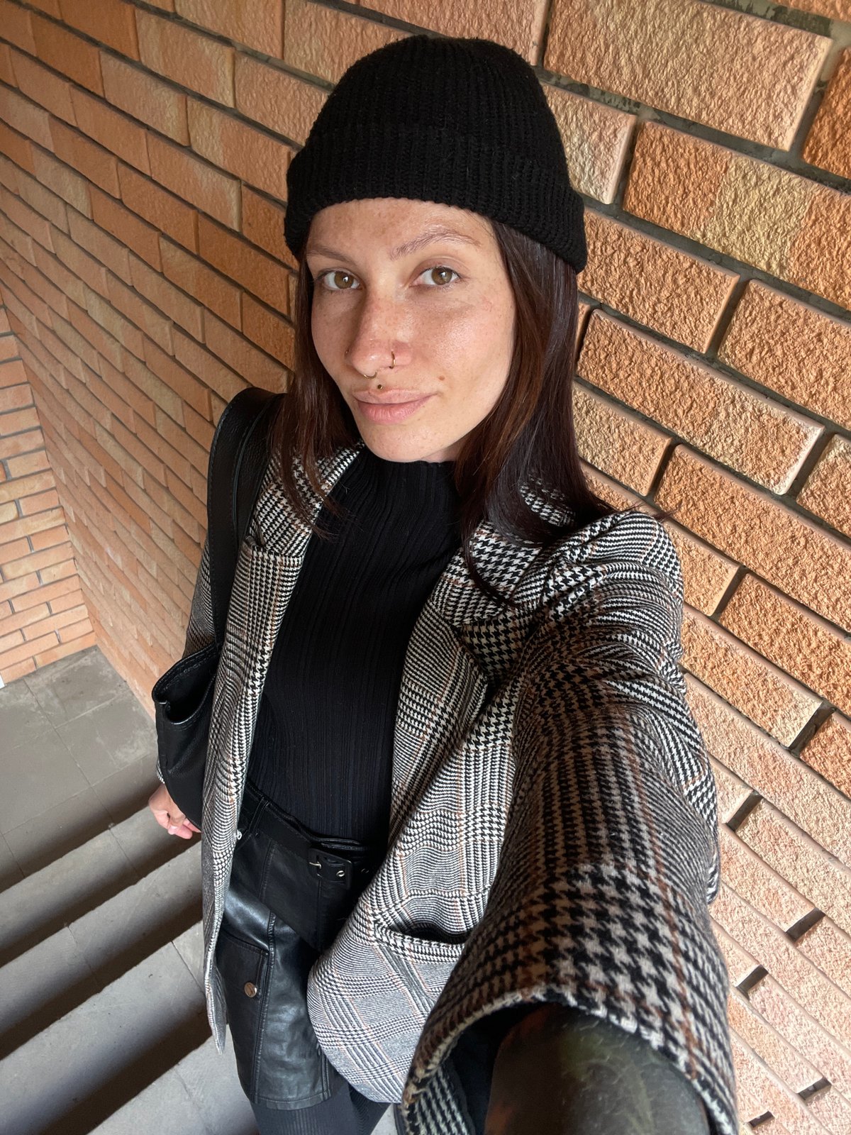 Woman poses for photograph on steps in Izhevsk