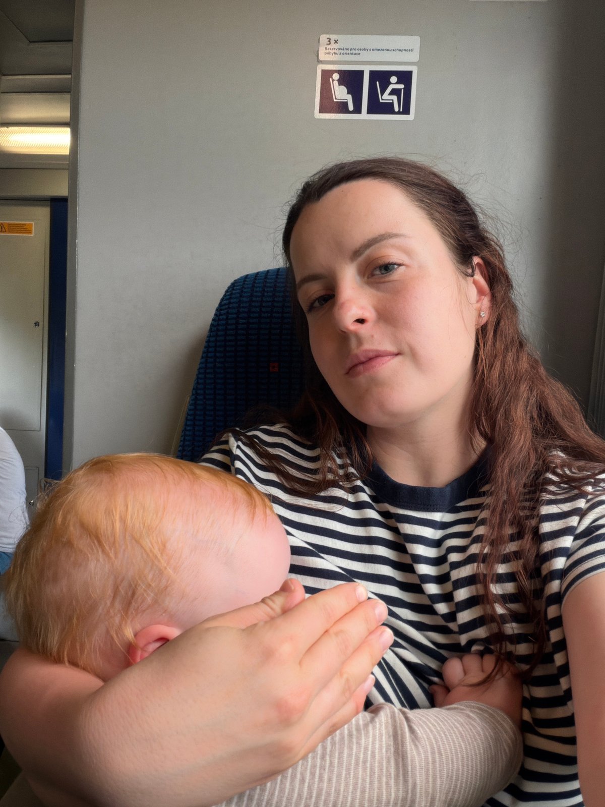 Mother and baby travel by train in Czech Republic