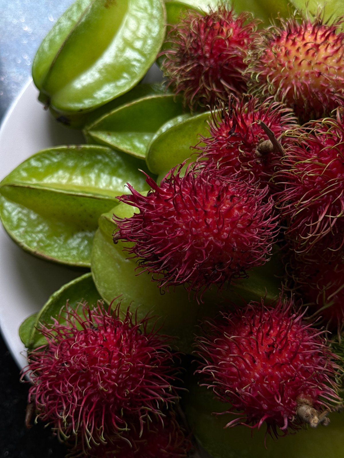 Tropical fruit close-ups in Goviyapana: rambutan, starfruit, and durian