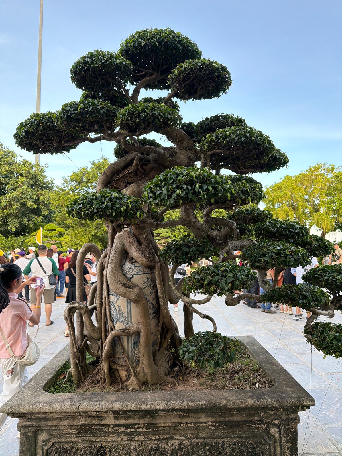 Tourists photograph Lady Buddha statue at Da Nang temple