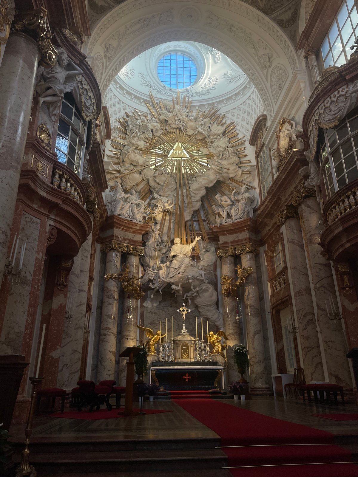 Inside and outside Vienna's Karlskirche on a sunny afternoon