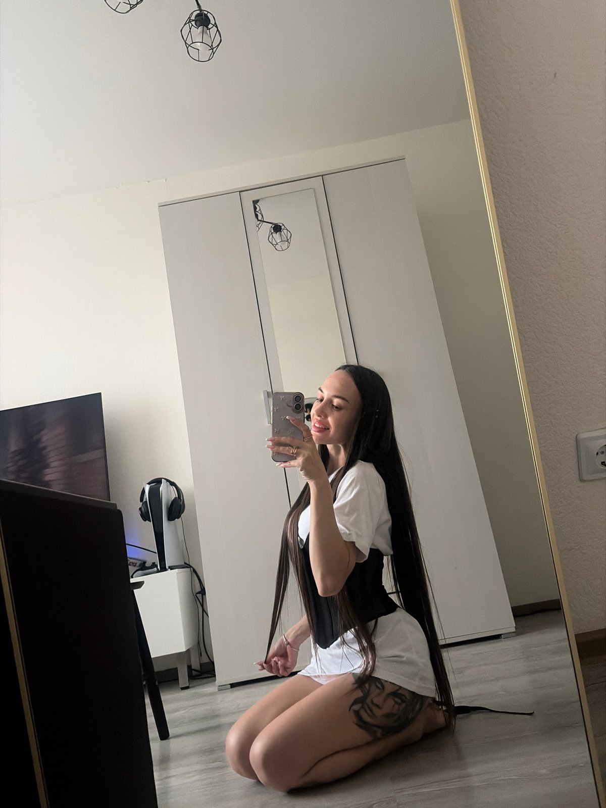 Woman takes mirror selfies in Saint Petersburg bedroom