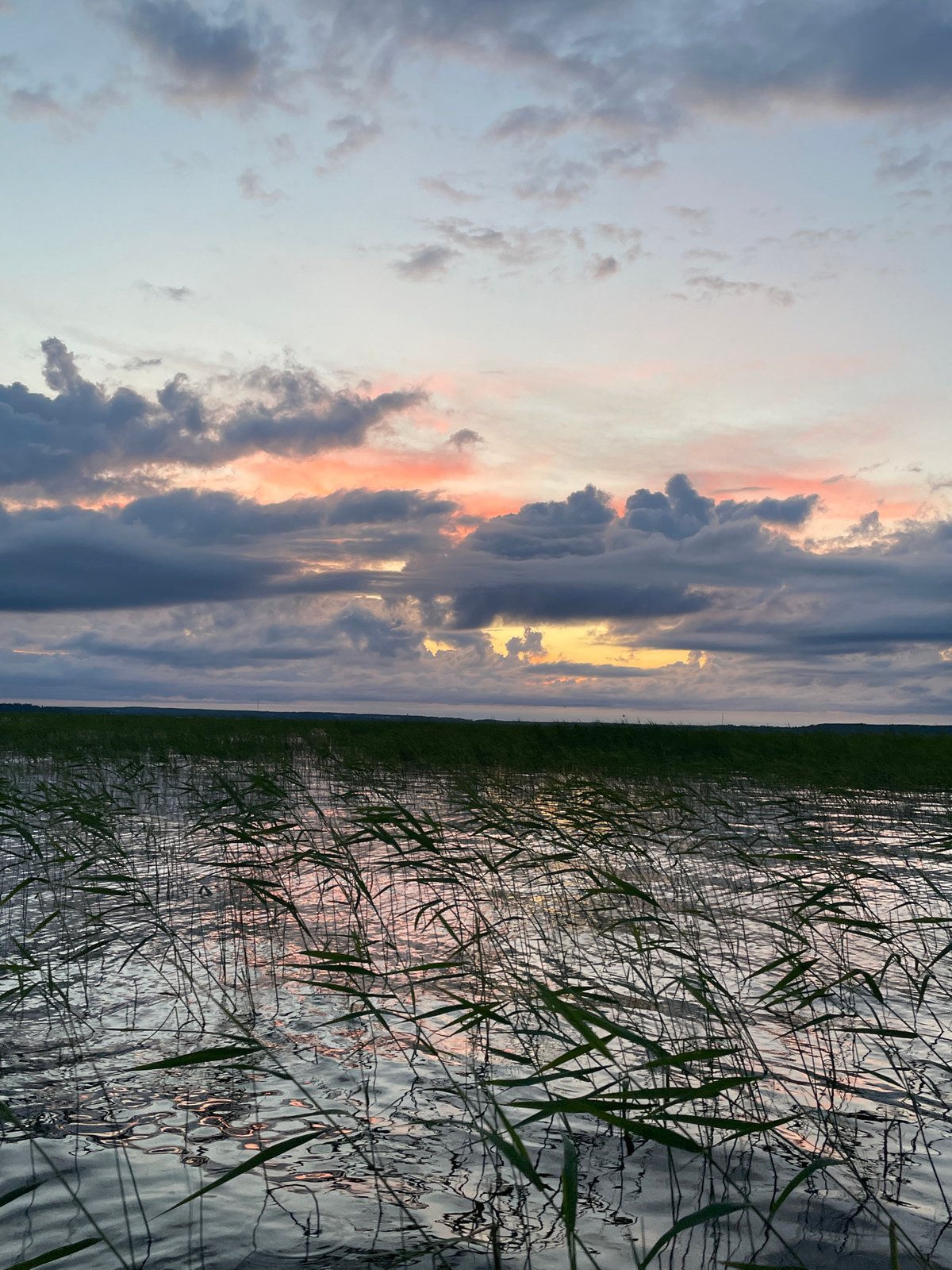 Evening on the lake: boating, swimming, and a quiet Russian sunset.