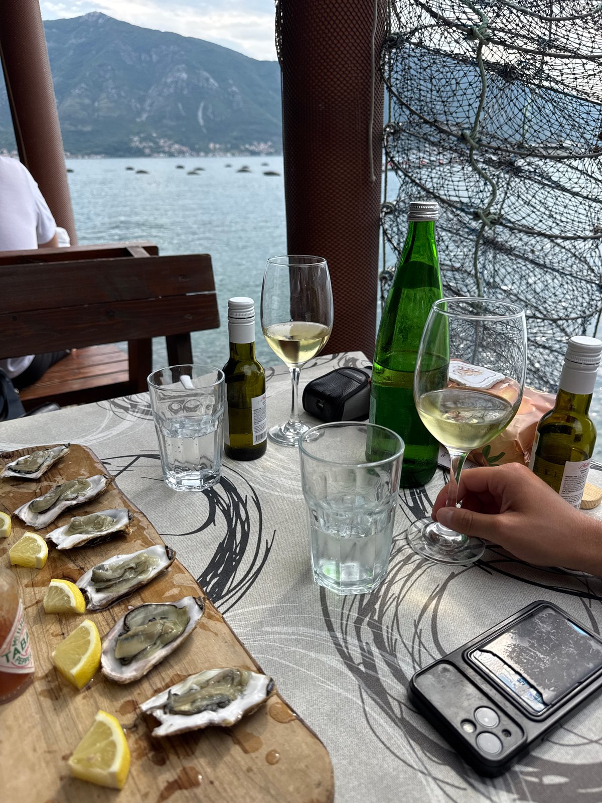 Outdoor dining with mountain and bay views in Montenegro
