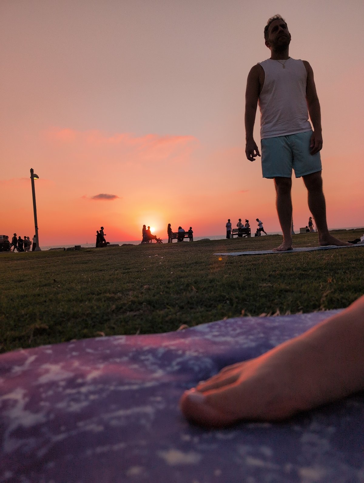 Yoga on the grass as the Mediterranean sun goes down