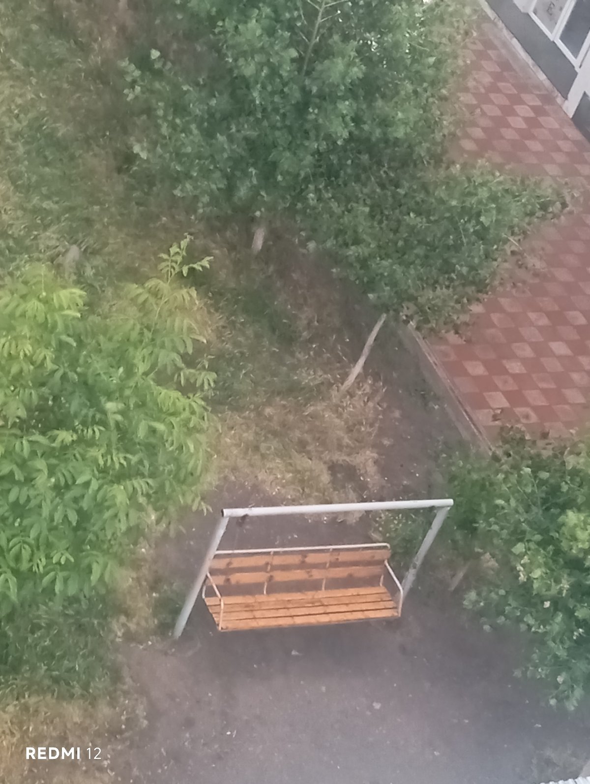 Empty swing set and coffee mug observed Saturday afternoon
