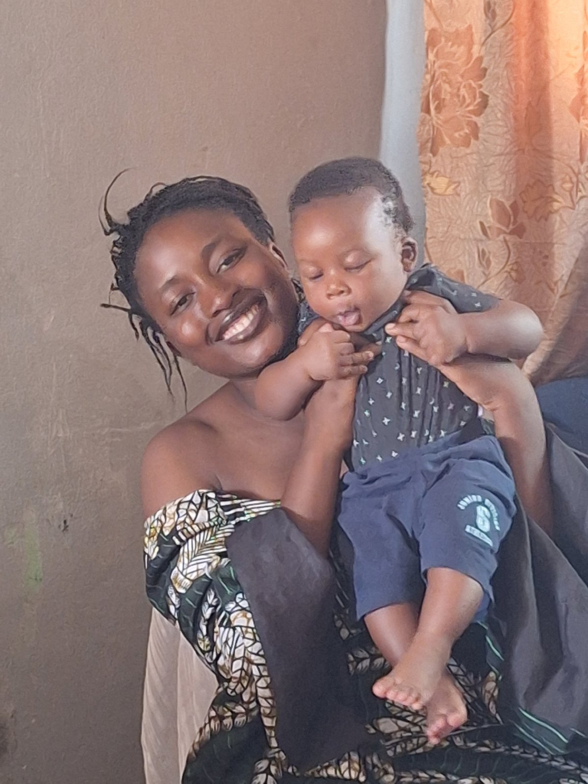Mother and baby share tender moment in Sabon Tasha