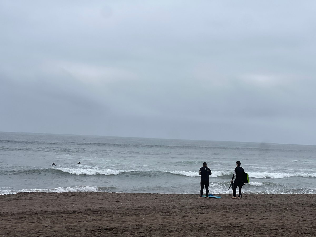 Surf session and beachside café life on Arica's coast