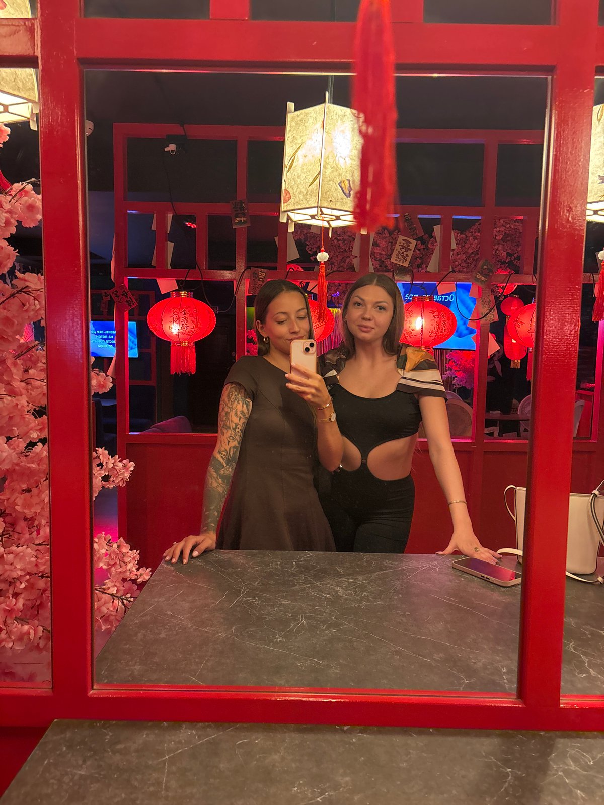 Woman documents Asian-themed restaurant interior in Saint Petersburg