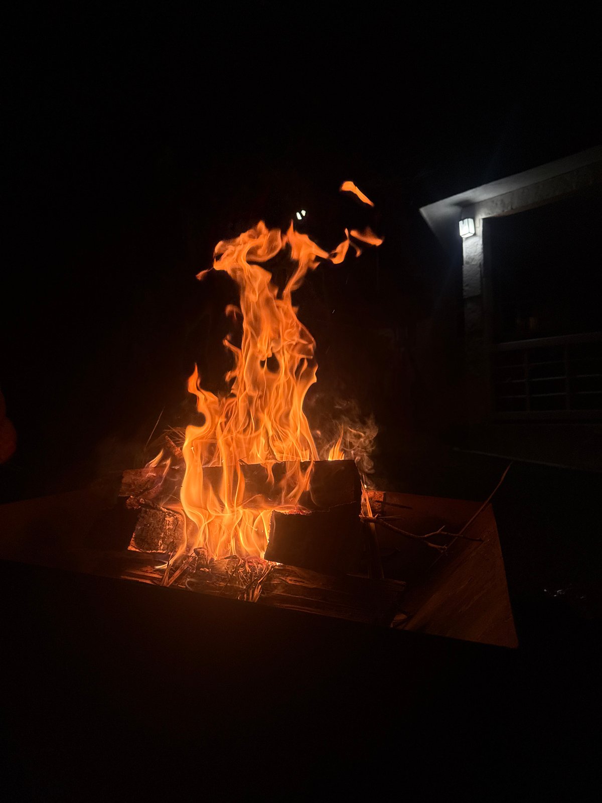 Controlled fire burns in Oaxtepec under orange moon