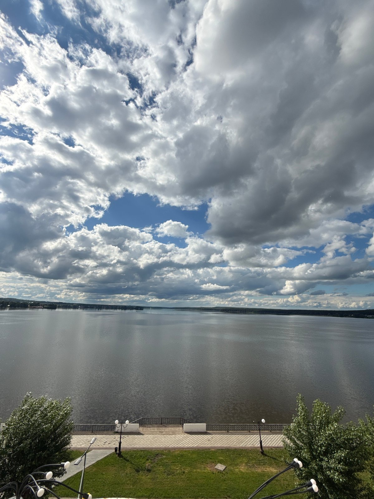 Mother and child enjoy morning outing at Votkinsk waterfront park