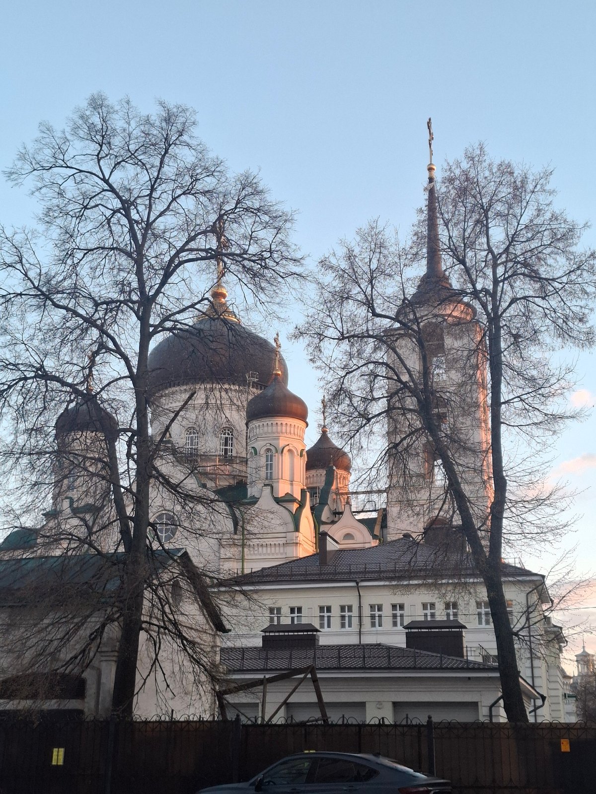 Orthodox cathedral complex observed during evening hours in urban park