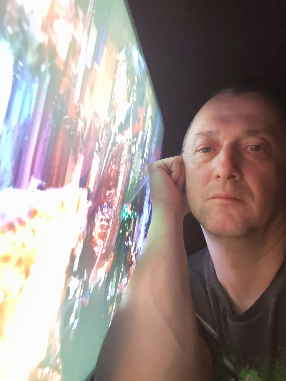 Middle-aged man photographed in contemplative pose in Volnoga