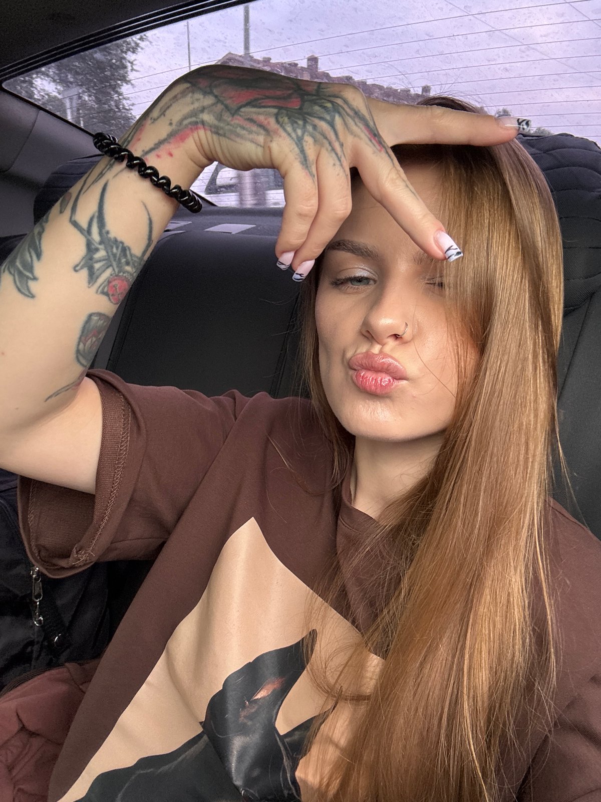 Candid car selfies near a Russian hypermarket on a cloudy day