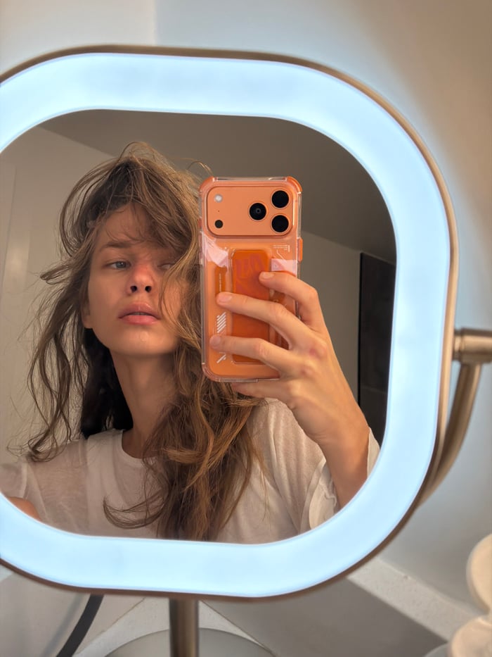 Woman takes mirror selfie in Fort Lauderdale early morning