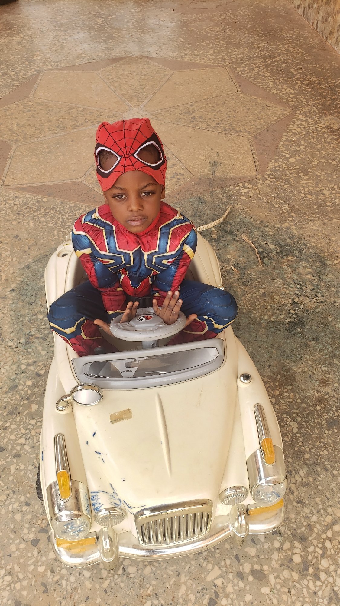 Children play with toy car in Sabon Tasha, Nigeria