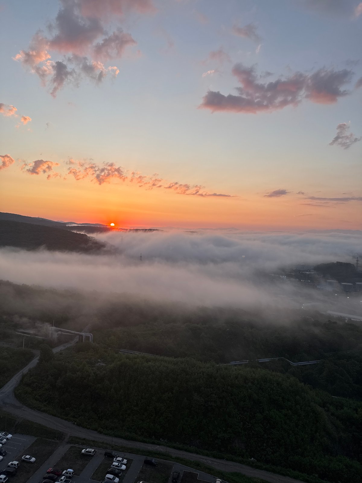Foggy sunrise blankets a Vladivostok valley at dawn