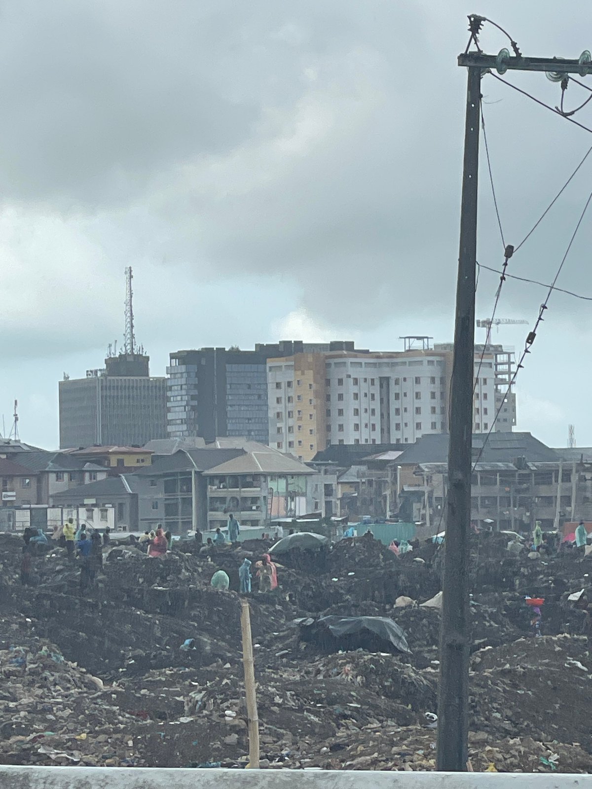 Lagos cityscape documented showing urban contrasts, scavenging activity