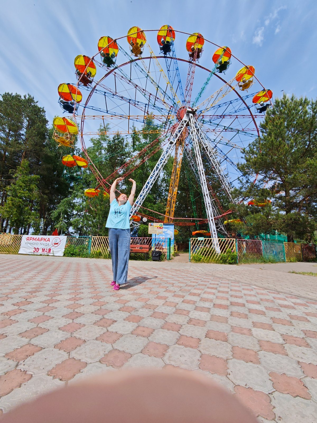 Mother and child enjoy morning at Chaikovsky fairground