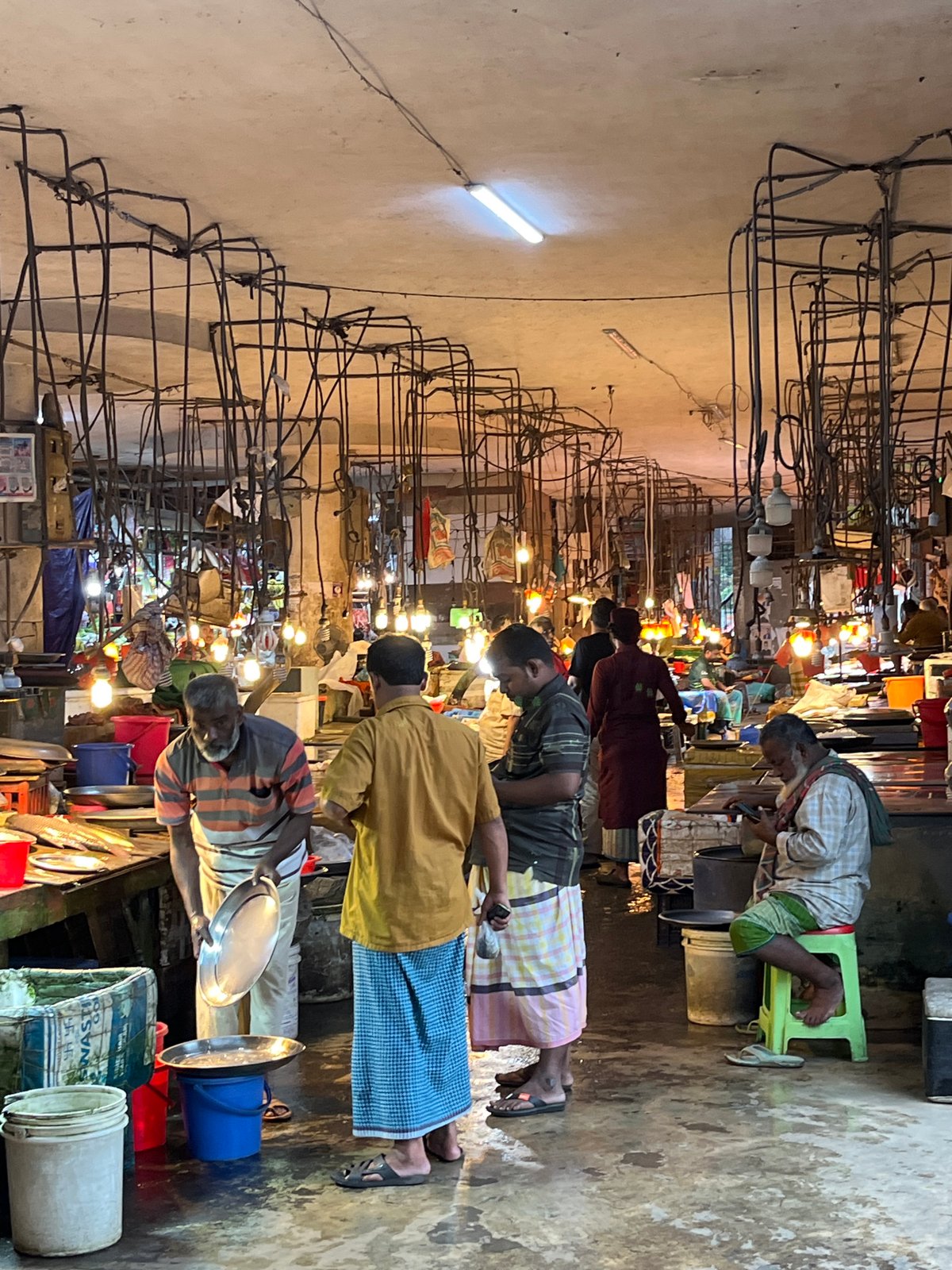 Morning street life documented across Dhaka marketplace and roads
