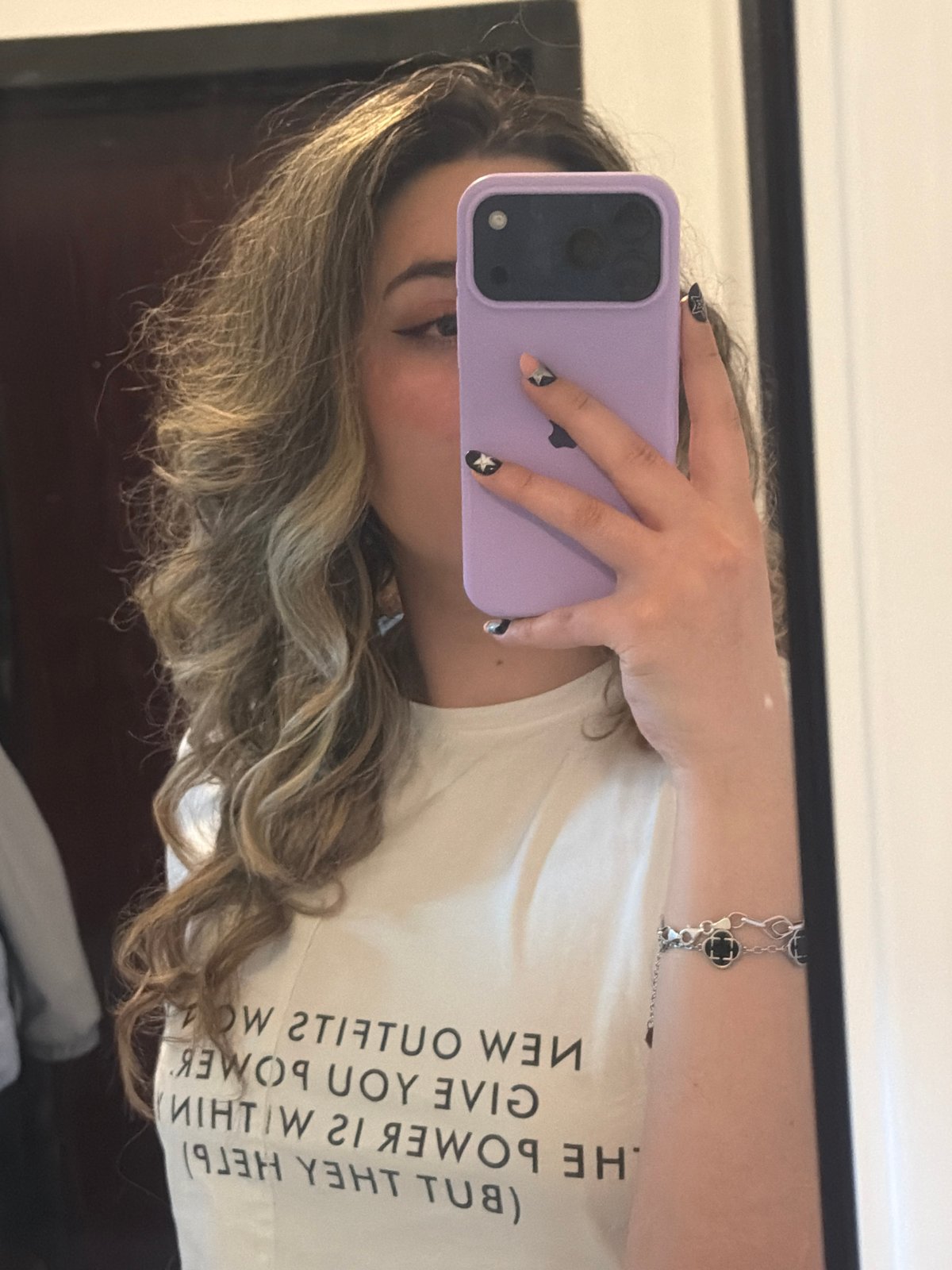 Person takes mirror selfie with lavender phone in Plovdiv