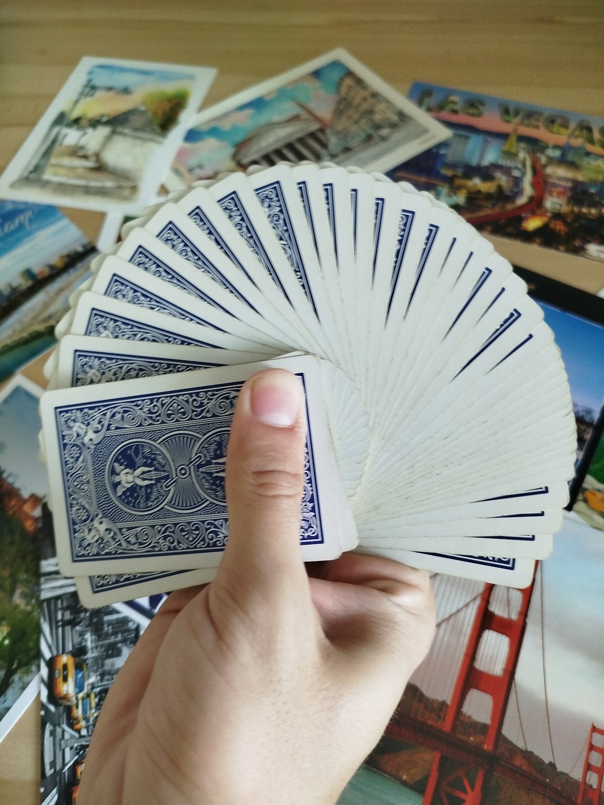 Travel postcards, souvenir magnets, and playing cards laid out in Varna