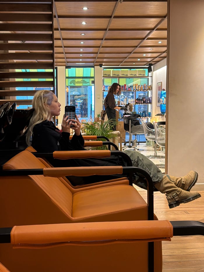 Woman gets hair treatment at Paris salon