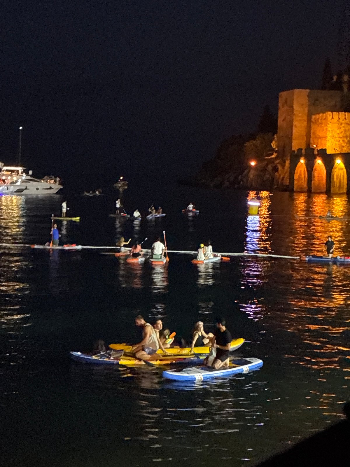A lit-up evening on the water in Alanya's harbor
