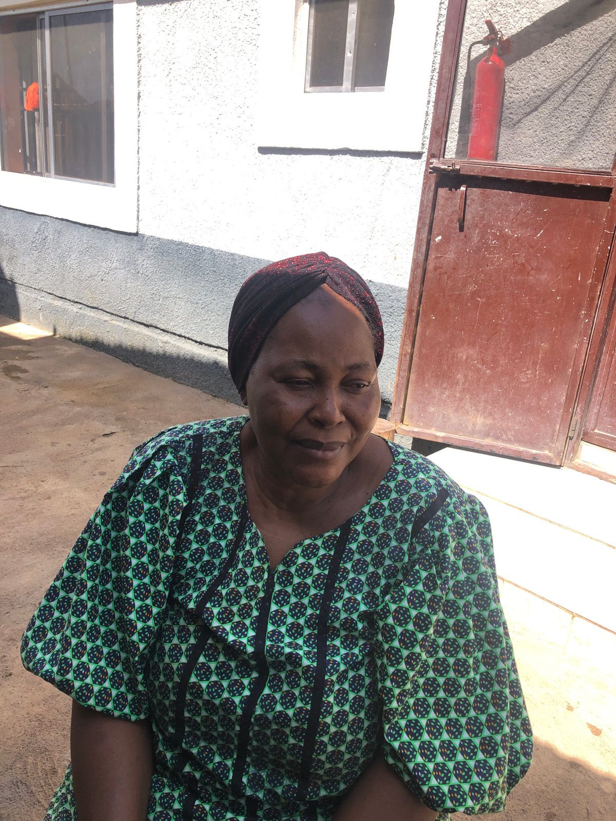 Morning hangout in Jos: people, portraits, and a busy cat