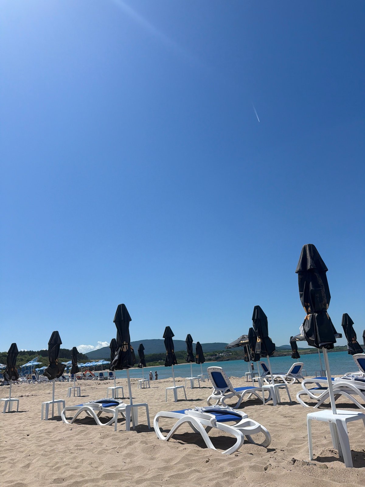 Empty beach umbrellas and loungers captured at Ahtopol Bulgaria
