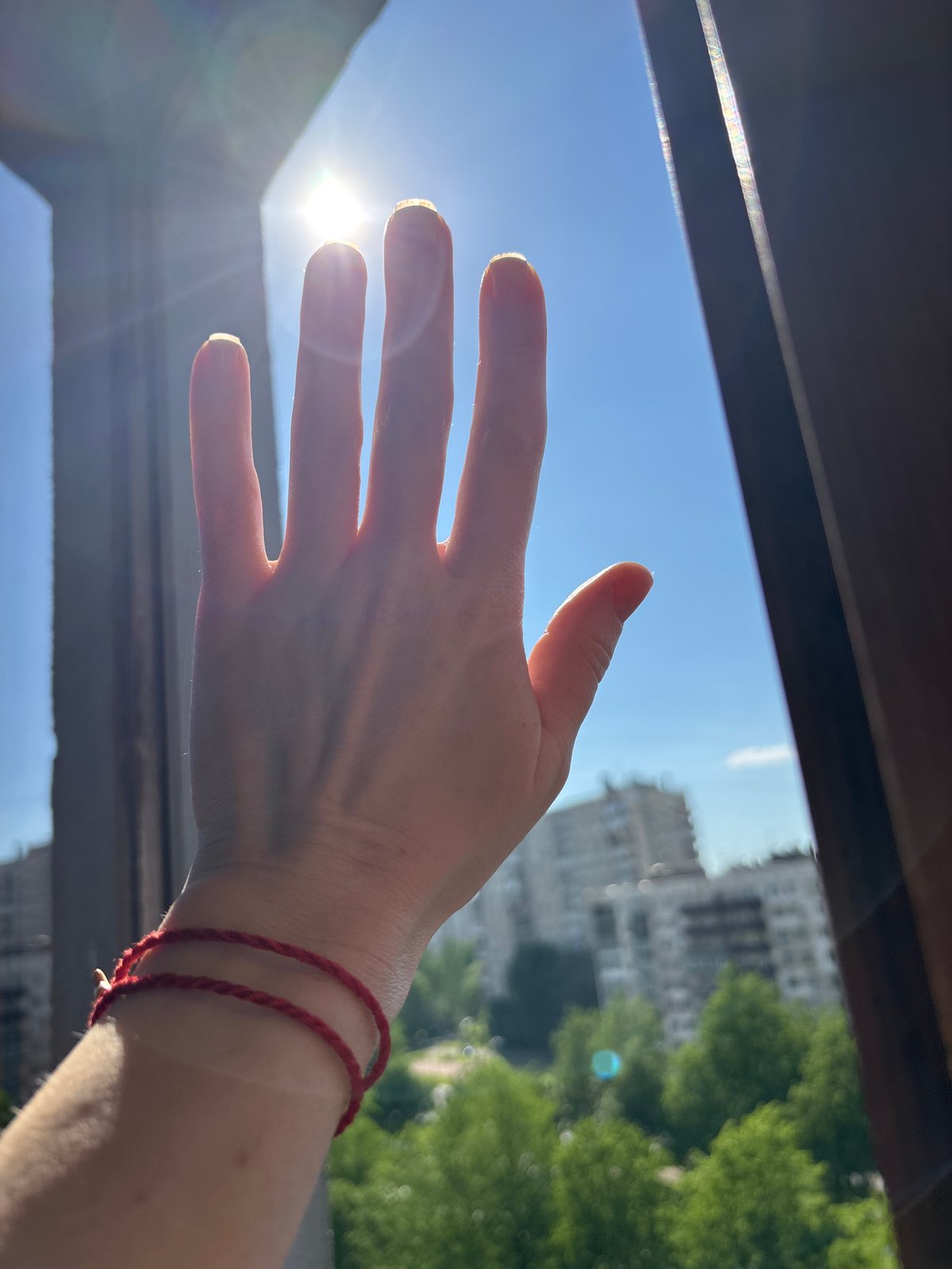 Woman relaxes by window, gaming session recorded in Russia